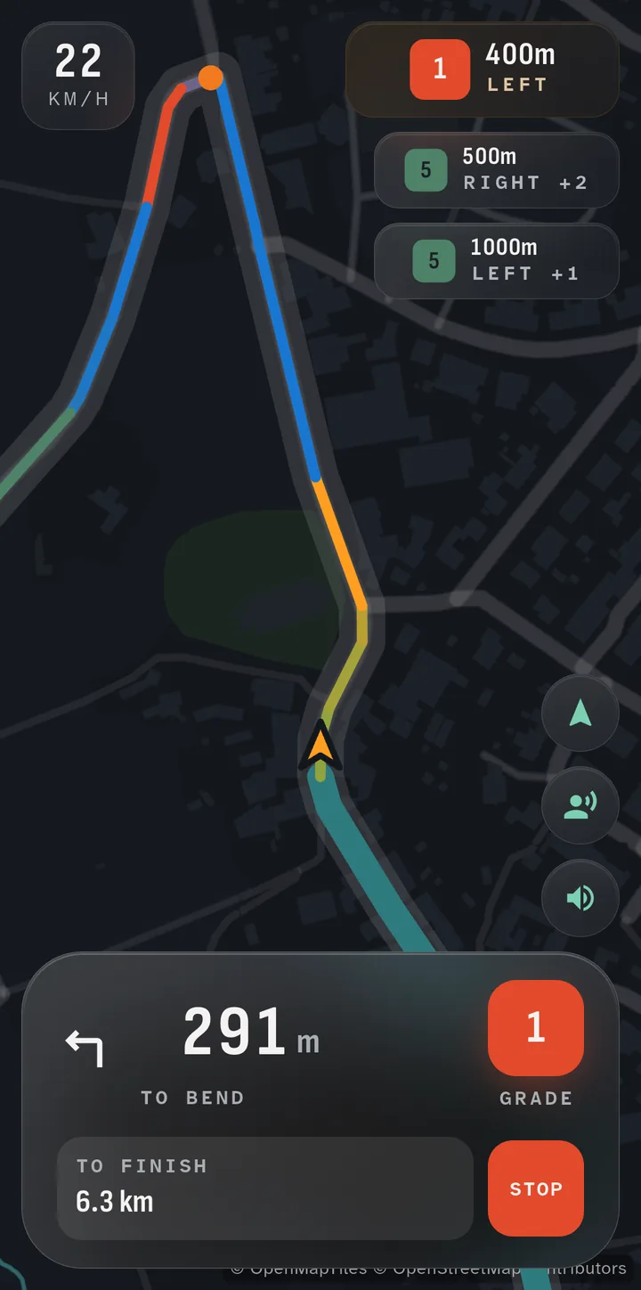 The TrueTrail navigation screen during a drive: a sharp left corner just ahead, with the route on the map.
